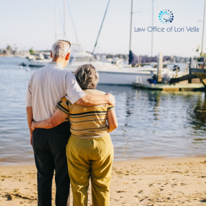 elderly couple standing on the shore watching boats