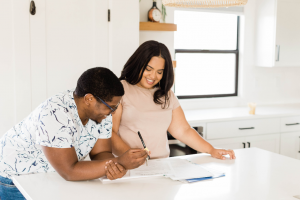 Couple reviewing Estate Planning documents and a Will in Florida